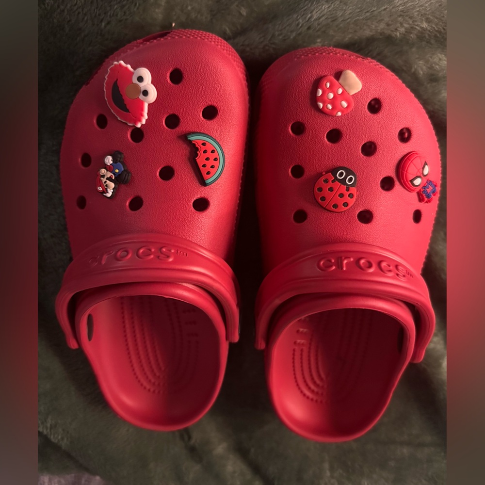 Excellent NEW crocs! Red Youth size J 4 With jibbitz. Were just too small.